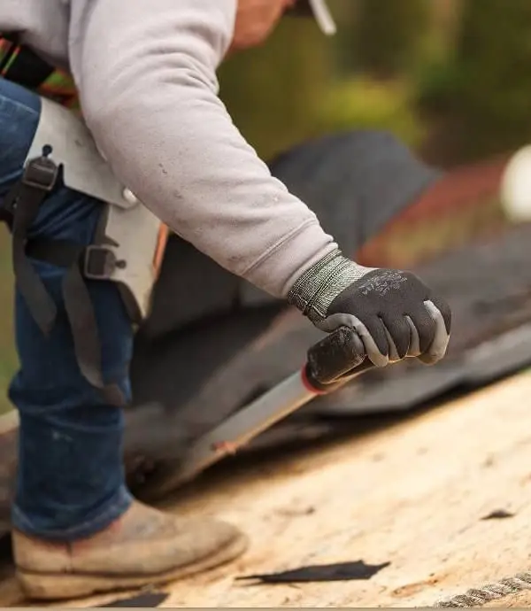 Roofing professional working on a roof