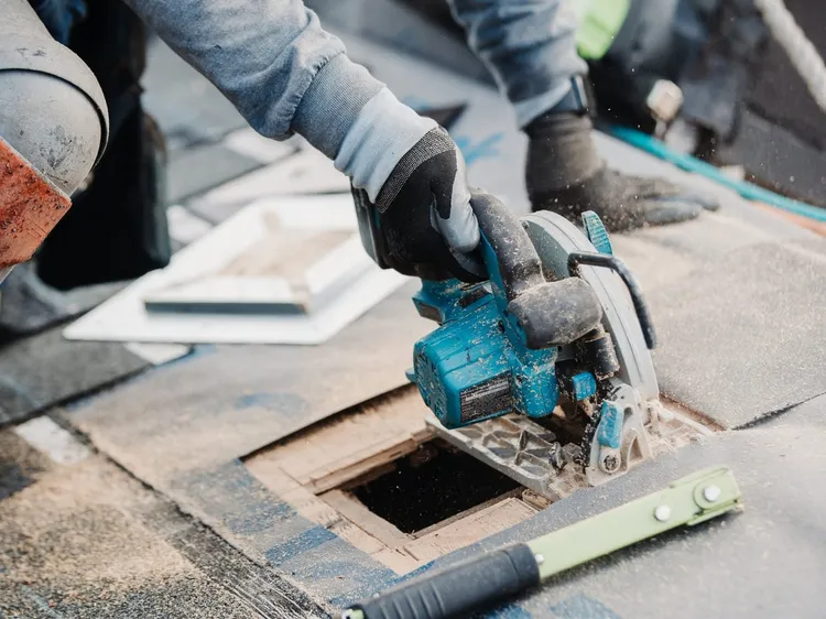 Sunnyside Roofing professional inspecting and repairing a residential roof